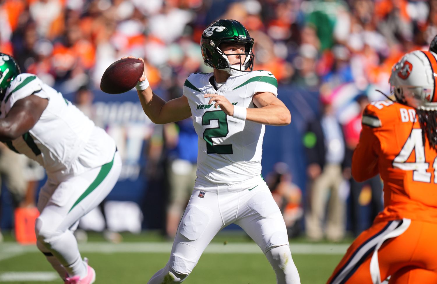 Jets' QB Zach Wilson (2) winds up to throw against the Broncos